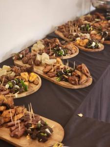 a bunch of plates of food on a table at Skyblue GuestHouse in Lubumbashi