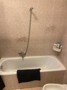 a bathroom with a bath tub and a toilet at La chiesina delle conce in Sarteano