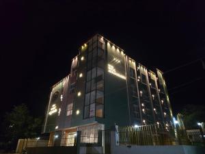 a building with lights on it at night at Hotel Royal Akkamahadevi in Sundi Penta