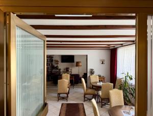 a living room with a table and chairs at Hotel Kull von Schmidsfelden in Bad Herrenalb