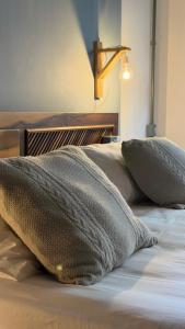 two pillows sitting on top of a bed at Praia Mole Hotel in Florianópolis