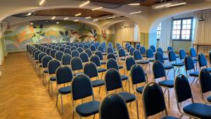 a row of chairs in a room with blue chairs at Praia Mole Hotel in Florianópolis
