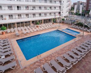 an overhead view of a swimming pool with chairs and a building at Port Fiesta Park in Benidorm +91 photos