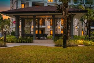 a gazebo in front of a building at Luxury 2 bedroom pool access apartment in Bang Tao Beach