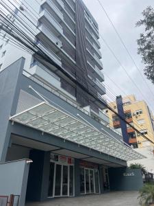 a building with a large tall building at Gaudi in Santa Cruz do Sul