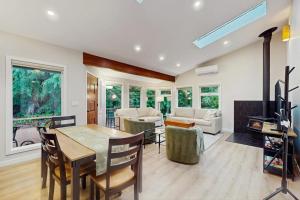 a living room with a table and chairs and a couch at Sanctuary on Park Ave in Hawley