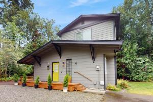 a tiny house with a yellow door at Sanctuary on Park Ave in Hawley