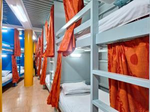a row of bunk beds in a dorm room at International Dormitory Mohsin Plaza in Sreemangal