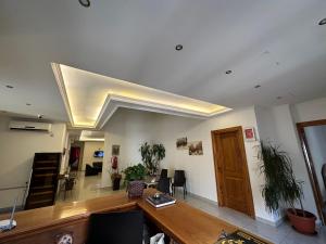 an office with a desk and a ceiling at Hotel St Jean in Zahlé