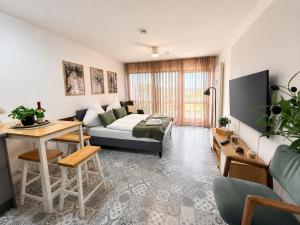 a living room with a couch and a table at Thermenblick in Bad Rodach +11 photos