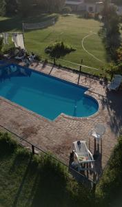 an overhead view of a swimming pool in a yard at Cabañas Donkaia in La Población