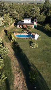 an aerial view of a house with a swimming pool at Cabañas Donkaia in La Población +10 photos