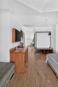 a room with two beds and a projection screen at La Farine Rooms in Fethiye