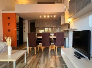 a kitchen and dining room with a table and chairs at Green Garden Gajac in Gajac