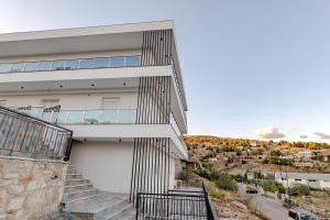 a view of a house with a staircase at SulMare Rooms in Sarandë +45 photos