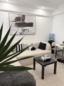 a living room with a couch and a table at Skyline Westlands with Gym in Nairobi