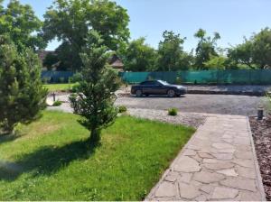 a car parked in a parking lot with a tree at Village Romantic Apartments by Český Krumlov Adults Only in Střížov +66 photos