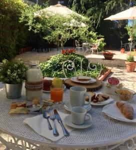 a table with breakfast food and drinks on it at Hotel Imperiale in Fiuggi