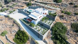an aerial view of a house in a mountain at Keiz Retreat in Ermoupoli