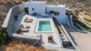 an aerial view of a house with a swimming pool at Keiz Retreat in Ermoupoli