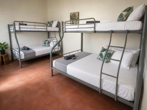 two bunk beds in a room with at Durano Seaside Retreat in Mercedes