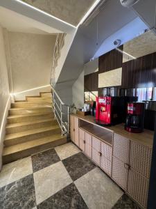 a staircase in a kitchen with aasteryasteryasteryasteryasteryasteryasteryasteryastery at Silvercity Hotel&Suits in Eskisehir