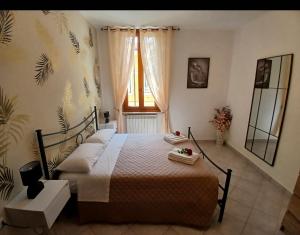 a bedroom with a bed and a window at Marruvium 1937's in Avezzano