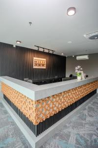 a lobby of a hotel with a reception counter at Hotel Valya Melaka Sentral Riverfront in Malacca