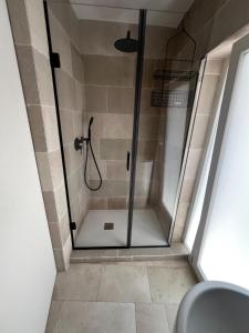 a shower with a glass door in a bathroom at affittacamere GOLD in Barletta +15 photos