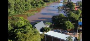 an aerial view of a river with cars parked at Cabaña El Dorado, Alojamiento in Puerto Cantera