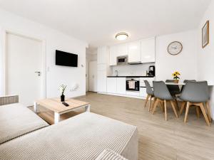 a living room with a couch and a table at TO-HAD, Modern Apartments next to U-bahn with free Wifi in Vienna