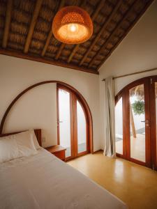 a bedroom with a bed and a large window at Villa Mia - Praia do Preá in Prea +46 photos