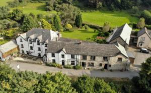 an aerial view of a large house with a yard at Staghunters Inn Hotel in Countisbury