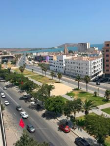 an aerial view of a city street with cars at Hôtel City Center in Nador