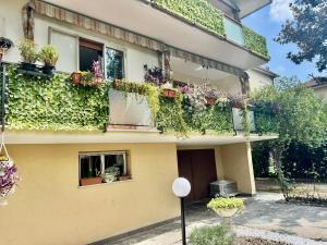 a house with plants on the side of it at Abir's Apartments 2 in Marghera