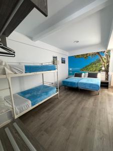 a room with bunk beds and a view of the ocean at Apartamentos Nueva Berria in Santoña