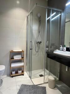 a bathroom with a shower and a sink at Un moment d'évasion in Rabat