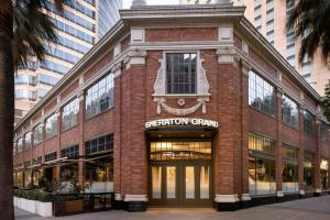 a red brick building with a sign on it at Sheraton Grand Sacramento in Sacramento