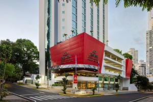 a red building on the side of a street at Marriott Executive Apartments Panama City, Finisterre in Panama City