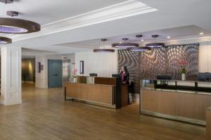a woman standing in the lobby of a building at Marriott Vacation Club®, San Francisco   in San Francisco