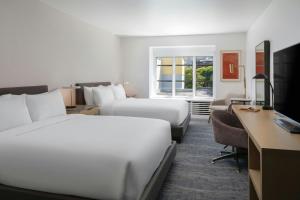 a hotel room with two beds and a desk at Marriott Vacation Club®, San Francisco   in San Francisco +37 photos