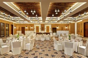 a banquet hall with white tables and white chairs at Bab Samhan, a Luxury Collection Hotel, Diriyah in Riyadh +73 photos