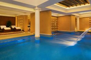 a pool in a hotel room with a swimming pool at Bab Samhan, a Luxury Collection Hotel, Diriyah in Riyadh