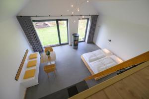 an overhead view of a bedroom with a bed and a table at Les Pieds au vert in Limbourg