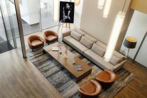 an overhead view of a living room with a couch and chairs at AC Hotel by Marriott Panama City in Panama City