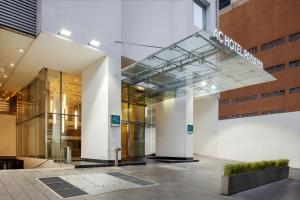 a lobby of a building with a sign on it at AC Hotel by Marriott Panama City in Panama City