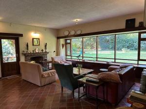 a living room with a couch and a table at The Researchers Rest in Arusha
