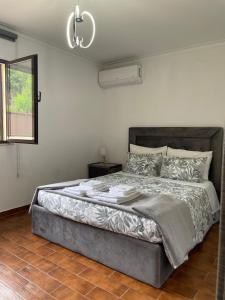 a bedroom with a large bed in a room at Relax House - Casa Castor in Valdosende