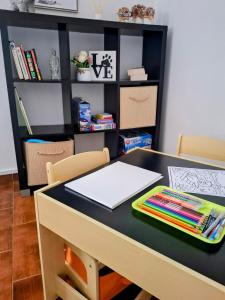 a desk with a table with a book on it at Relax House - Casa Castor in Valdosende