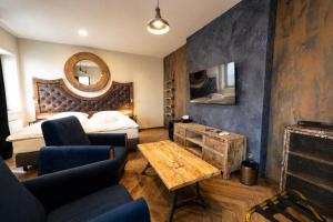 a hotel room with a bed and a fireplace at Boutique rooms Fabrika in Děčín